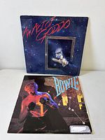 Front covers of Bowie and Goddo LPs