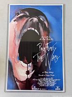 Front view of Pink Floyd The Wall poster in acetate sleeve