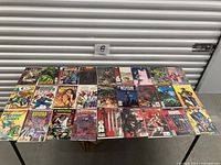 Overview of 24 comic books on table