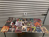 Full table view of 24 assorted comic books