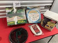 All five items on red table