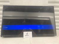 Front view of Toshiba LCD TV powered on showing blue “No Video” bar