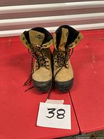 front view of pair of tan and black safety boots