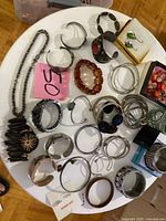 Overview of assorted jewelry on round table