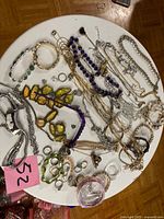Overview of jewelry lot on table