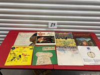 All eight album covers laid out on table