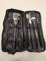 Full view of grilling set opened in case