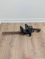 Full view of hedge trimmer showing blade length and overall condition