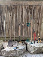 All tools lined against fence showing full lot