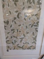 full view of framed painting showing motif and matting