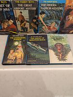 All seven Hardy Boys books front covers