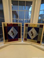 both stained glass windows standing in bay window