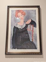 Full view of framed Modigliani print on wall