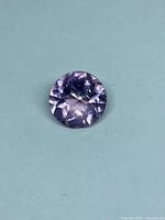 Top view of round light purple amethyst gemstone
