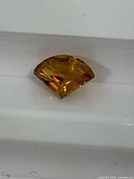 Front view of fan-cut citrine showing colour and faceting