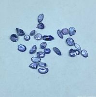 Group of loose tanzanites on background