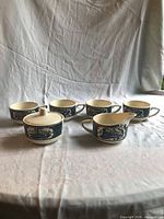 Full set showing sugar bowl with lid, creamer, four cups