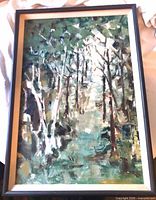 Full view of framed forest landscape painting