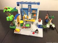 Overall view of feeding station structure, tree, figures and accessories