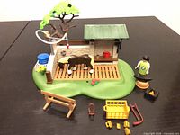 Overall view of playset pieces assembled on base