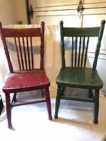 Front view of red and green oak children’s chairs
