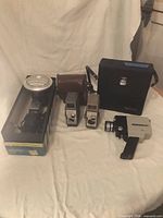 Group shot showing all cameras, cases and boxed movie light