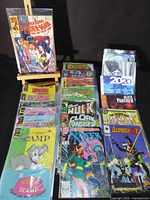 Group shot of entire lot showing stacked, bagged comics and several visible titles