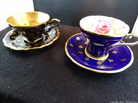 Both teacup and saucer sets side by side