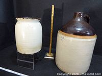 Jug and crock side by side with ruler for scale