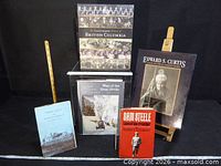 Front view of all six books upright