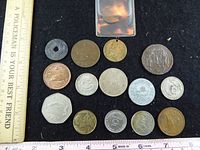 Overview of all 15 coins with rulers for scale