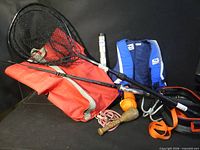 Group shot showing all items including life jacket, net, rods, gear bag, mallet, buoy, rope, strap, reflector tube