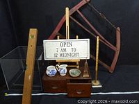 Full lot showing sign, cabinet, bow saw, level, ceramics, Eiffel Tower, acrylic box