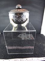 front view of bowl with lid on display stand