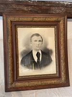 Front view of framed charcoal portrait