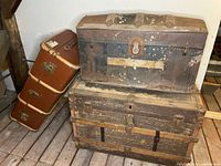 All three steamer trunks showing relative sizes and condition