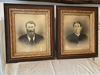 Both framed portraits side by side