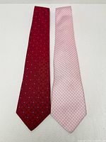 Both ties side by side displaying full front patterns