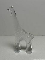 Front view of clear glass giraffe figurine