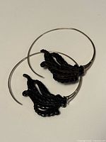 Both earrings together showing overall design