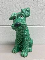 Front view of green Sylvac terrier figurine showing facial details and overall condition