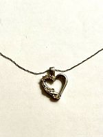 Front view of necklace showing heart pendant and chain