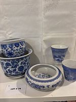 Group view of five blue and white ceramic pieces