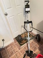 Full view of unfolded Fairway two-wheel pull cart