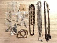 All items laid out showing assortment of necklaces, bracelets, earrings