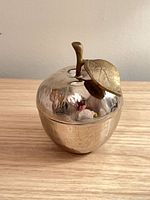 apple shaped silver metal jar front view