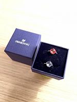 Two rings in Swarovski box, showing crystal colors