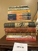 Stack of nine vintage children’s books showing spines
