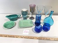 Group shot of all 11 glass and ceramic pieces