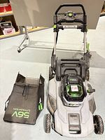 Overall mower with detached grass bag